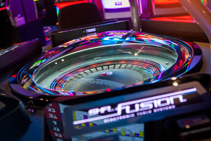 FUSION™ AUTO-ROULETTE offers automated roulette gaming on a sleek & compactly designed six wide-screen ergonomic player positions, each with a free view of the wheel and maximum operational security.